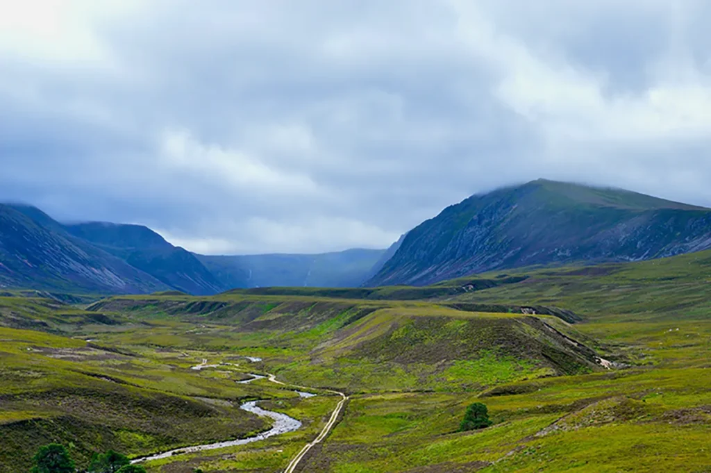 Remote green valley in the Scottish Highlands, a prime location for wild camping in the UK.