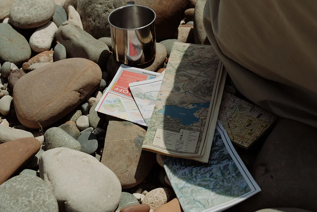 hikers os map on stone floor
